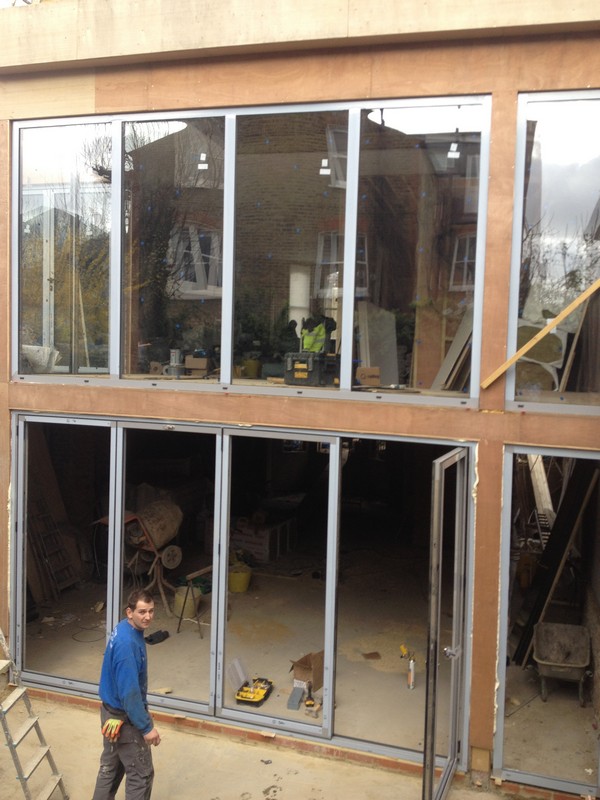 Aluminium bi-fold doors with two-storey glazing in Stamford Hill
