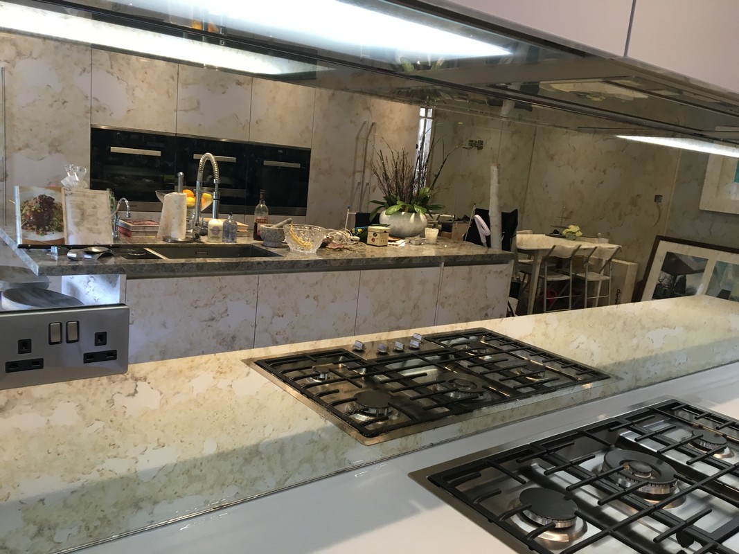 Mirror glass splashback in Stamford Hill luxury kitchen