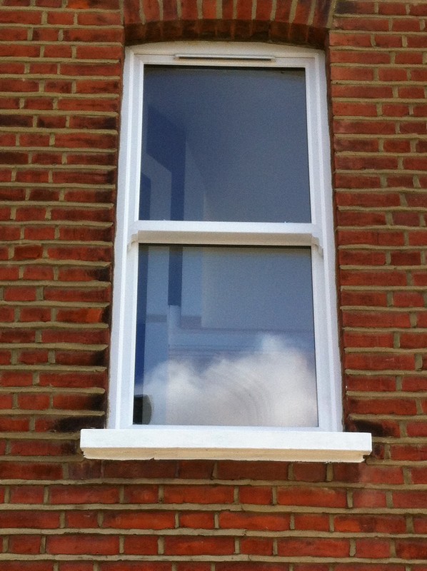 uPVC sash window on Victorian red brick house in Stamford Hill